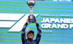 Race winner raises trophy on the podium at the Formula 1 Japanese Grand Prix, 2026.