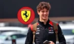 Smiling young man in a black Ferrari racing jacket outdoors, with a red Ferrari logo graphic above him.