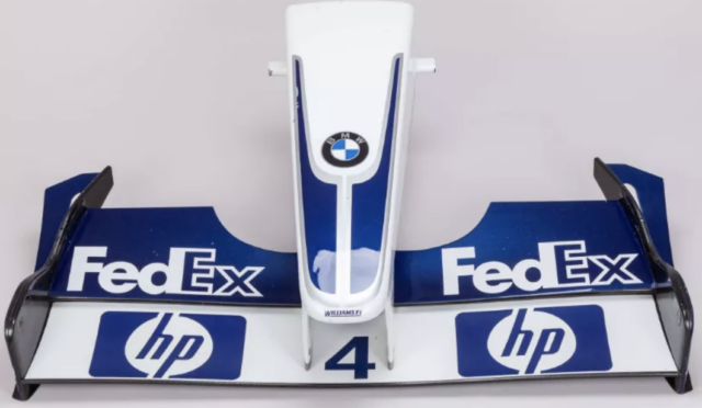 Front section of a Williams Formula 1 car with BMW logo, blue and white livery, sponsor decals FedEx and HP.