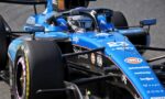 Blue Formula 1 race car close-up of cockpit and front wing, with sponsor logos visible (Barclays, Gulf).