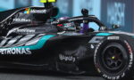 Mercedes‑AMG Formula 1 car on track with driver in cockpit, featuring sponsor logos like Microsoft, Petronas, TeamViewer, AMD and CrowdStrike.