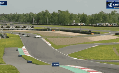 Go-kart race on Moscow Raceway during an SMP F4 Championship session, with several karts on a straight section of the track and sponsor banners along the barriers.