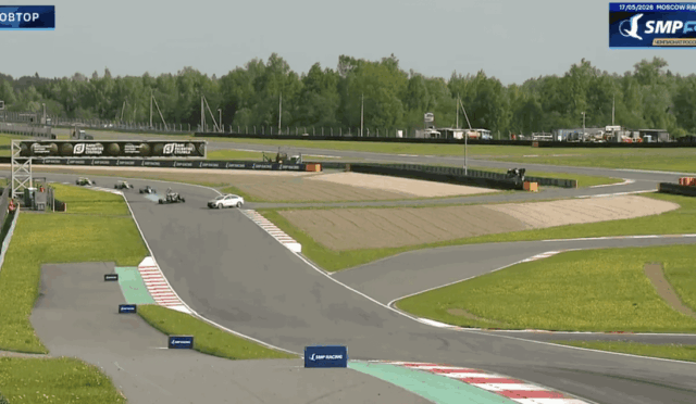 Go-kart race on Moscow Raceway during an SMP F4 Championship session, with several karts on a straight section of the track and sponsor banners along the barriers.