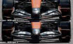 Front-on view of a McLaren Formula 1 car showing the orange nose and detailed front wing in MON spec 1