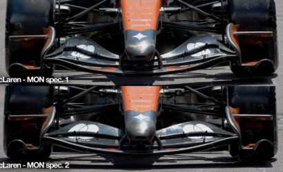 Front-on view of a McLaren Formula 1 car showing the orange nose and detailed front wing in MON spec 1