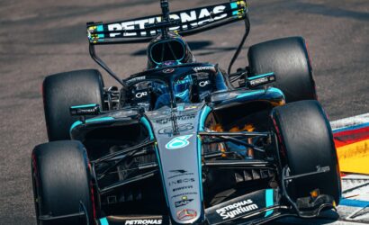 Mercedes‑AMG Petronas Formula 1 car on track, front view showing sponsor logos and teal accents