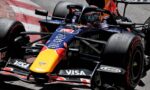 Close-up of a Red Bull Racing Formula 1 car on track, showing the colorful nose, sponsor decals, and front wing details.