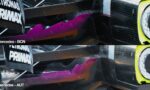 Close-up of a Mercedes F1 car's front wing with carbon fiber texture, magenta winglet, and a yellow headlight ring.