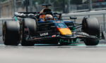 Red Bull Racing Formula 1 car on a race track, front-left view with prominent VISA and Red Bull logos.