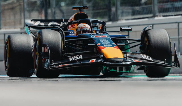 Red Bull Racing Formula 1 car on a race track, front-left view with prominent VISA and Red Bull logos.
