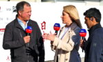 Three reporters interview a man outdoors, holding Sky Sports microphones as the woman speaks animatedly between them.