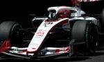 White and red Formula 1 race car from a low front-angle, sponsor logos visible on the nose and body.