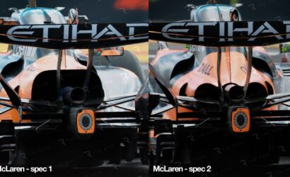 Two McLaren Formula 1 cars facing the camera from the front, orange-and-silver livery with sponsor logos across the nose.