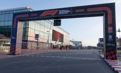 F1 finish arch over a road beside a glass building, with Formula 1 Gran Premio de España branding on it.