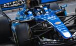 Blue Williams Formula 1 car cockpit up close with front wing and sponsor logos like Barclays visible.