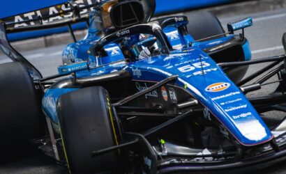 Blue Williams Formula 1 car cockpit up close with front wing and sponsor logos like Barclays visible.