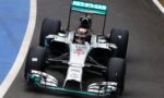 Top-down view of a Mercedes Petronas Formula 1 car on the track, front angled toward the camera with number 23 on the nose.