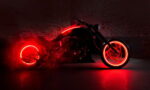 Black motorcycle in a dark brick-walled garage, with red neon rims and underglow lighting.